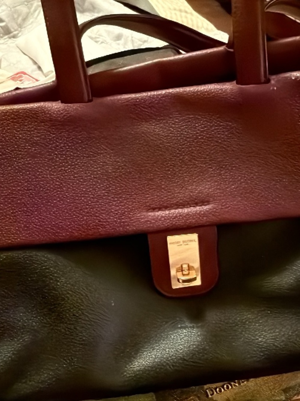 Dooney & Bourke Black and Burgundy Leather Satchel with Gold-Tone Turn Lock